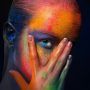 Model with colorful art make-up, close-up